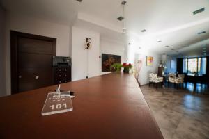 a room with a large wooden table with a sign on it at Hotel Restaurante Canzana in Pola de Laviana