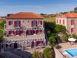 an aerial view of a house and a swimming pool at Heliades Maisonettes in Mythimna