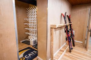 a room with skis hanging on the wall at Red Shutter Inn in Rossland