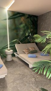 a rendering of a bedroom with a bed and plants at Hotel Joli in San Marino
