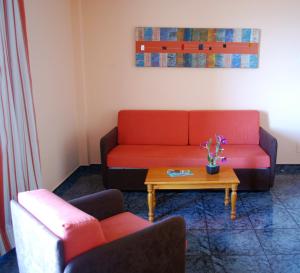 a living room with two couches and a coffee table at Apartamentos Jucar in Frontera