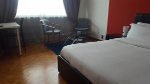 Postel nebo postele na pokoji v ubytování B&B in Arena L' Opera