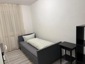 a living room with a couch and a table at Sofia2 in Urschmitt +1 photo