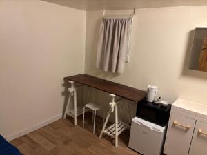 a small kitchen with a counter in a room at Octavie in Villeurbanne