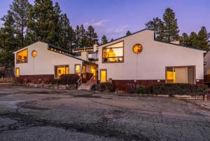 a large white house with a lot of windows at Cloud Cap Hideaway in Pagosa Springs, CO in Pagosa Springs