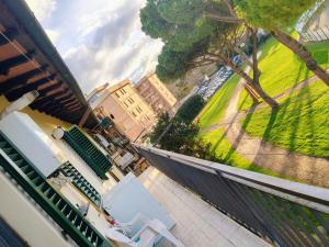 a view of a balcony with chairs and a park at Maria Luisa Home in Poggibonsi