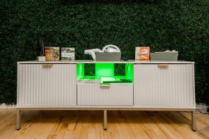 a white cabinet with a laptop on top of it at Quiet & Walkable - Stampede, BMO, Nightlife & Eats in Calgary +53 photos