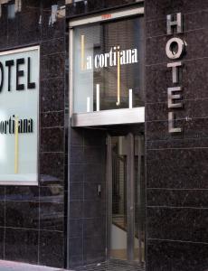 a sign on the side of a building at Hotel La Cortijana in Logroño