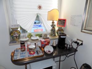 a table with items on it with a window at Blue Sky House in Taormina +24 photos