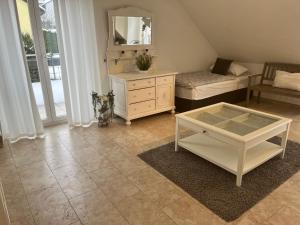 a living room with a dresser and a mirror at Residenz Jäger 3 Schlafzimmer in Lohfelden