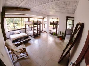 a living room with bunk beds and a couch at Casa NATIVO in Jardin