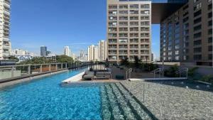 a large pool of water on top of a building at Almagah 227 - Studios de Alto Padrão no Tatuapé - SP in São Paulo