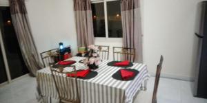 a table with two teddy bears sitting on top of it at Beachside Vacation House in Ras al Khaimah