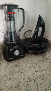 a blender sitting on top of a counter at Beira Mar Apartment Aracaju in Aracaju