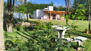 a view of a house from the garden at Complejo de cabañas Vida Paz in Las Calles