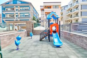a playground with a slide in a city at Sasha Collection by AlezziNord10 in Constanţa
