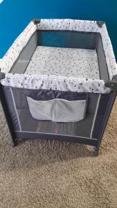 a bed frame with a mattress on the floor at GA home in Milwaukee
