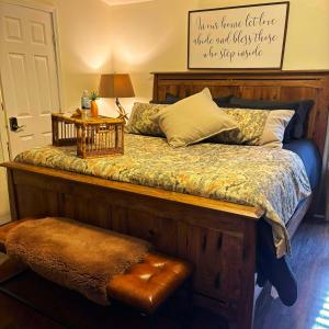 a bedroom with a bed with a sign on the wall at The Lodge in O'Brien