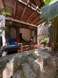 an outdoor patio with a hammock in a house at la baxada mazunte in Mazunte