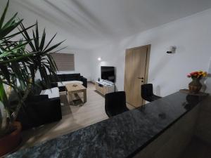a living room with a couch and a table at Kuća za odmor "Mira" in Foča