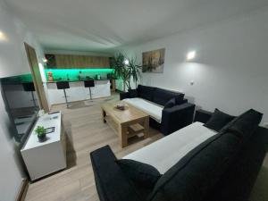 a living room with a couch and a table at Kuća za odmor "Mira" in Foča