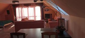 a living room with a couch and a table at ELEKTRa in Stare Bielice