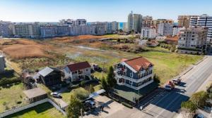 an aerial view of a house in a city at Hotel Blu Mare Shengjin in Shëngjin