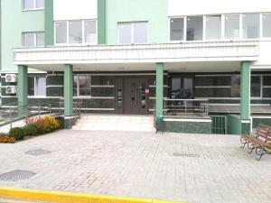 a building with a bench in front of it at Comfort Apartment on Bogdanivska street 7b in Kyiv