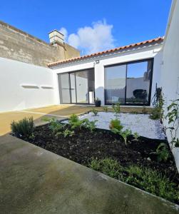 a garden in front of a house at Atlantic Dreams II in Pico da Pedra