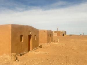 a building in the middle of the desert at Bivouac Porte du Désert in Mhamid