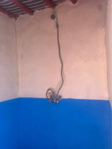 a wire hanging from a wall in a room at Bivouac Porte du Désert in Mhamid