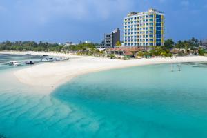 an aerial view of a beach with a tall building at h78 Guraidhoo in Guraidhoo