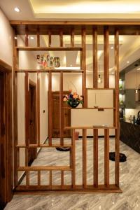 a room with a loft bed with a desk at Sai Guest House in Chavakachcheri