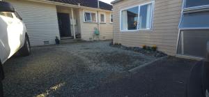 a car parked in front of a house at Cozy corner on Cohen in Nelson