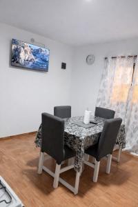 a dining room with a table and chairs at Departamentos Turísticos Cloe 2 in Fiambalá