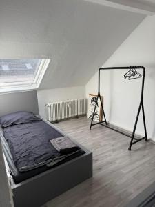 a bedroom with a bed in a attic at Monteurwohnung Krefeld WorkStay in Krefeld +7 photos