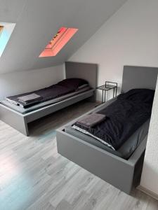 a bedroom with two beds in a room at Monteurwohnung Krefeld WorkStay in Krefeld