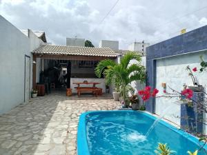 a swimming pool in a yard with a house at Casa de veraneio - FA Beach in Conde