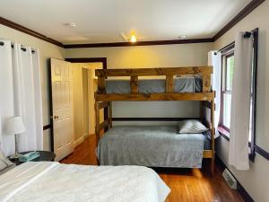 a bedroom with two bunk beds and a window at Family-Friendly Strasburg Escape | 50 Mile Views in Strasburg