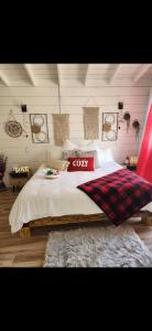 a bedroom with a bed with a cork sign on it at Natural Island in Adjuntas