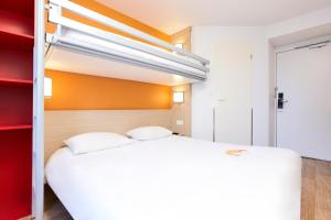 Letto o letti in una camera di Première Classe Lyon Sud - A7