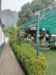 a park with a train on a track at Casa Verde in Quillabamba
