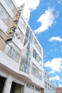 a building with a sign on the side of it at Kymeron Hotel in Juliaca