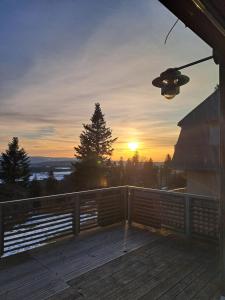 a view of the sunset from the deck of a house at Brend Hotel und Gasthof in Furtwangen