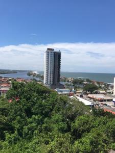 a view of a city with a tall building at Pousada Souza & Souza in Barra Velha
