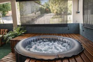 a hot tub sitting on a wooden deck at Casa Isabel in Rincon