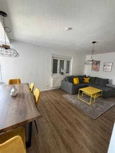 a living room with a couch and a table at Ellis Häusle in Nagold