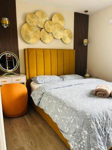 a bedroom with a bed and two plates on the wall at Haven Stays - D15A5DF in Tyrrelstown
