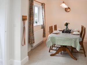 a dining room with a table and chairs at Number 23 in Wooler