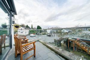 a balcony with a bench and a view of a street at Waterhead Bath Suites - Parking and Light Breakfast in Ambleside